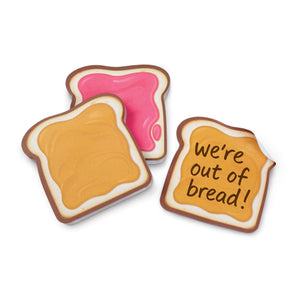 Two bread-shaped toast with pink jelly and one with 'We're out of bread!' text on a white background