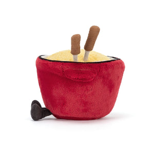 Side view of a Jellycat plush toy resembling a red pot containing cheese fondue and two skewers on a white background