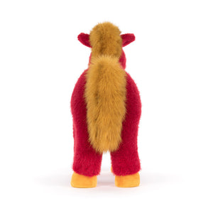 Back view of a Jellycat plush toy horse with red body and yellow mane, tail and hooves on a white background