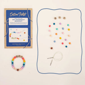 Cotton Twist bracelet-making kit with colorful beads, string, and packaging on a white background.