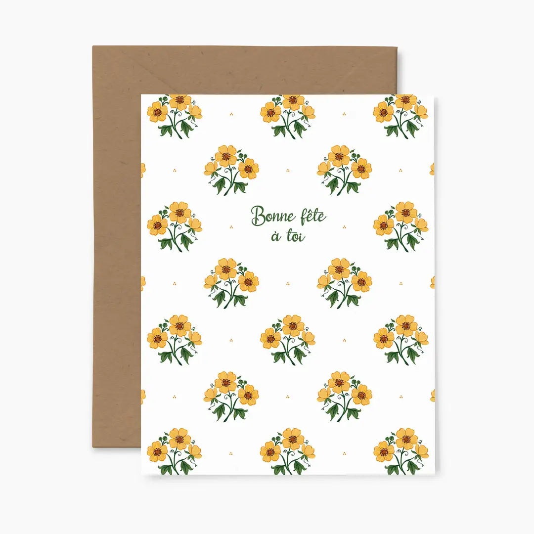 Greeting card featuring a yellow floral pattern on a white background with the words 'Bonne fete a toi' and a brown envelope.