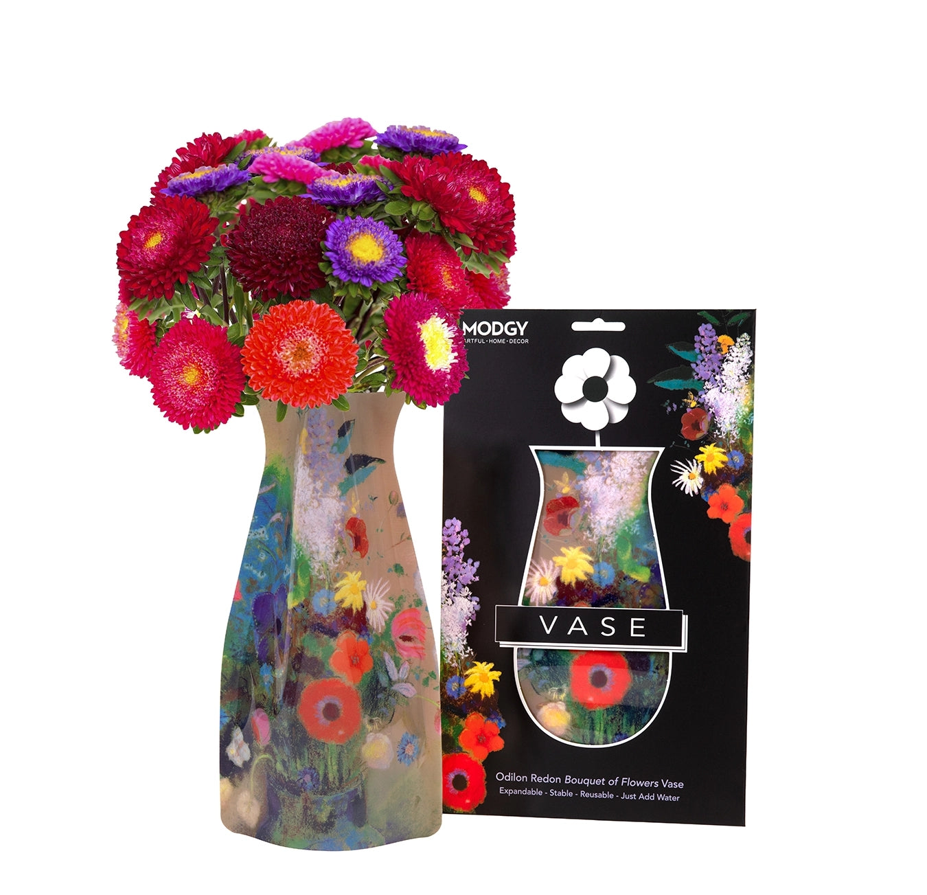Expandable vase with a colorful floral design filled with a bouquet of flowers. The vase is placed beside it's packaging labeled 'MODGY Vase'.
