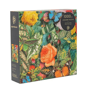 Jigsaw puzzle box with floral and butterfly design on a white background.