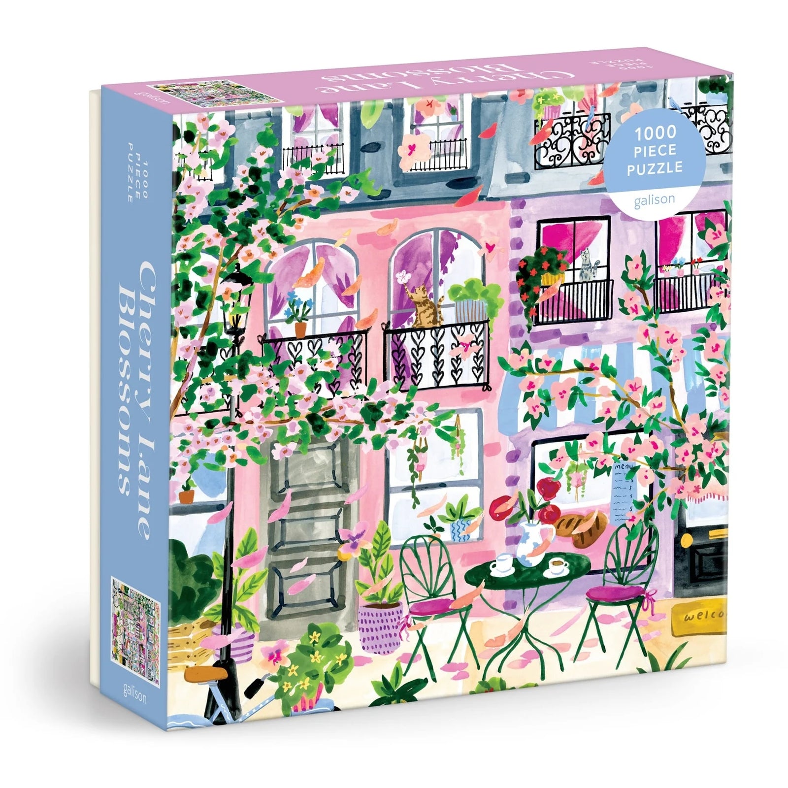 Jigsaw puzzle box with a colorful illustration of a street scene with cherry blossoms and a cafe.