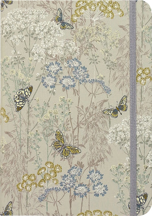 Hardcover notebook with floral and butterfly design on a beige background.