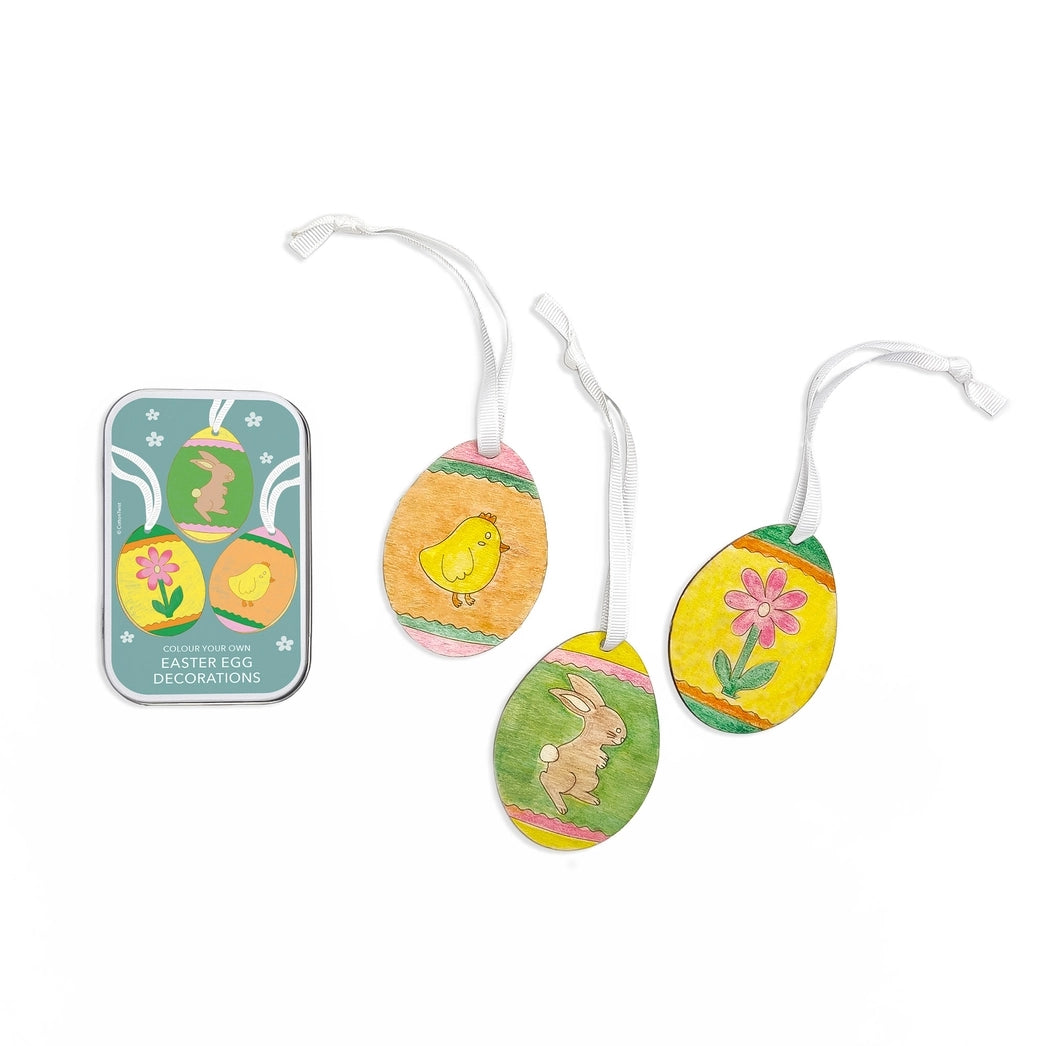 Set of Easter egg decorations with a packaging container on a white background.