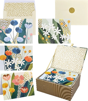 Set of floral greeting cards and envelopes in a box with various card designs.