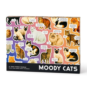 Packaging for a puzzle featuring colourful illustrations of cats with funny text on a pink and purple background. 
