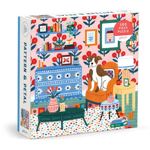 Puzzle box featuring an illustration of a brown and white dog sitting on a chair in a colourful living room setting. The text 'Pattern & Petal' is printed on the side of the box. 