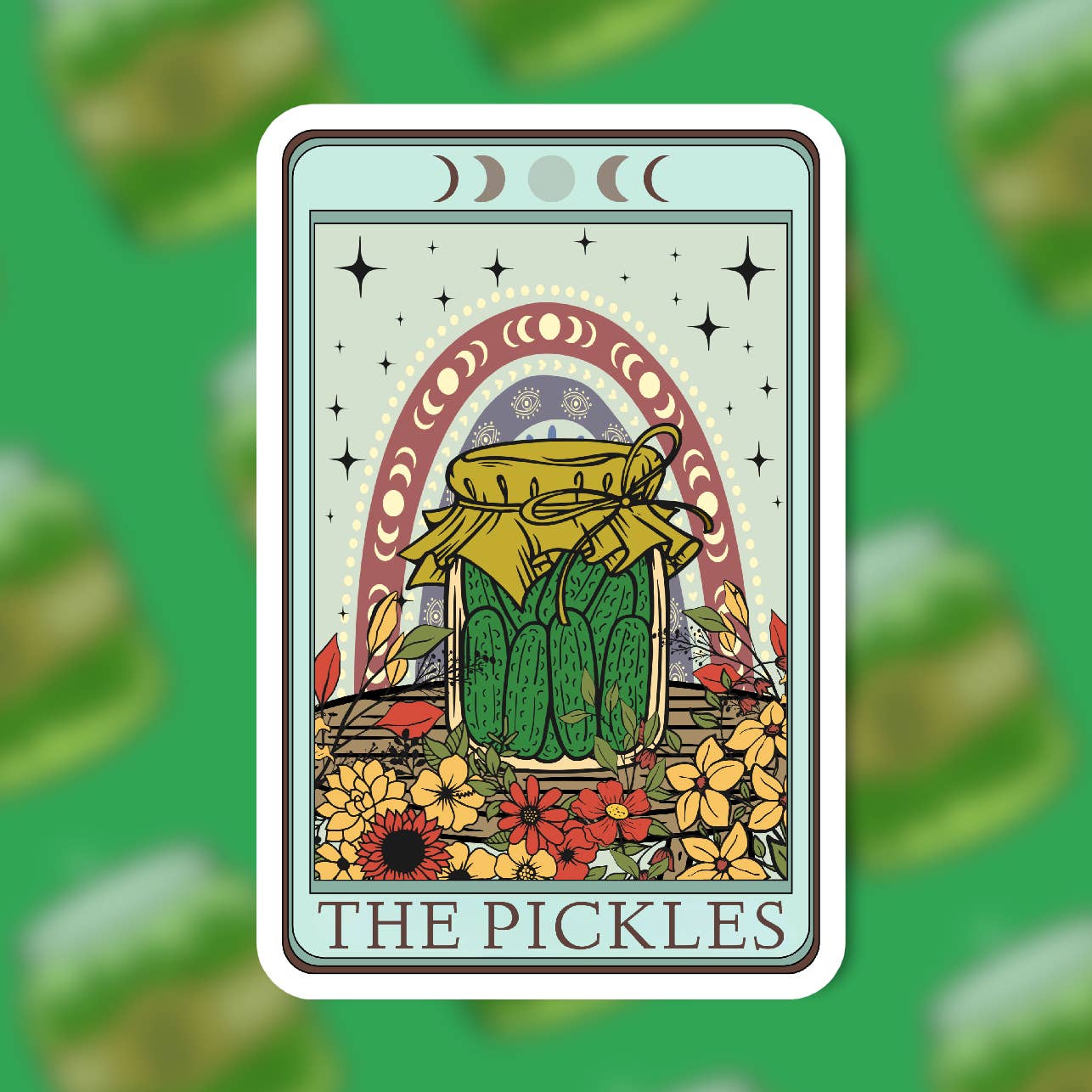 A tarot-style card featuring a jar of pickles surrounded by flowers and an arch motif decorated with moon phase shapes. The pickle jar and arch are centred on the sticker while the text 'The Pickles' is printed at the bottom.