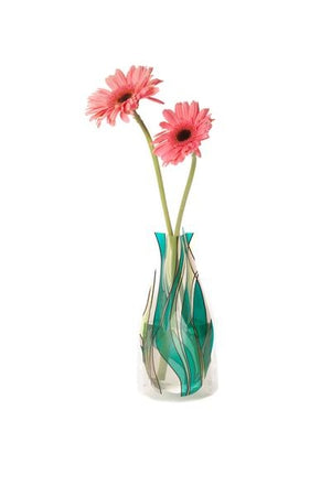 Expandable vase with a green abstract design filled with pink flowers on a white background.