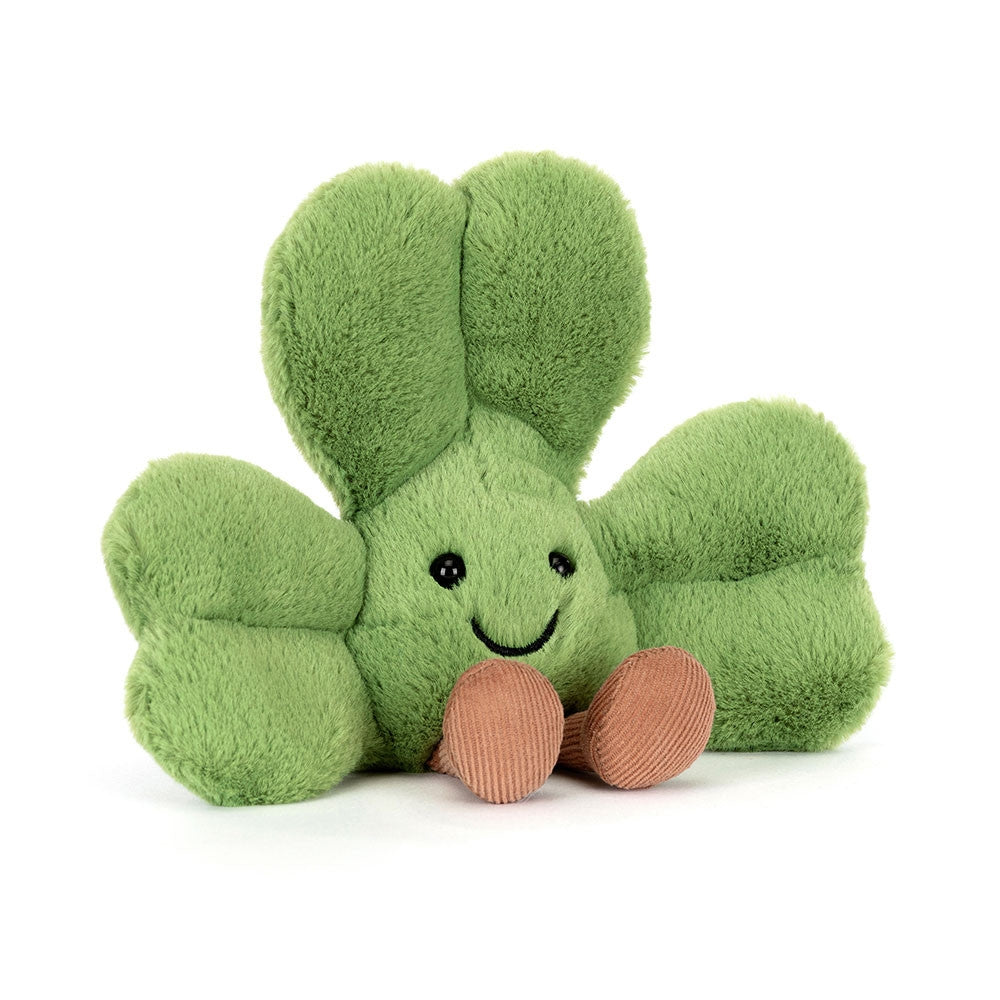 Front view of a Jellycat green clover shaped plush with a smiling face on a white background