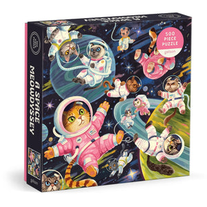 Puzzle box featuring illustrations of cat astronauts floating in space along with some planets and stars in the background. The text 'A Space Meowdyssey' is printed on the side of the box. 
