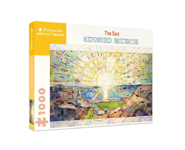 white puzzle box with yellow accents. the centre of the box has an image of one of Munch's bright, sunrise paintings