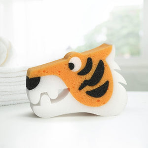 A tiger-shaped kids' bath sponge on a white surface.