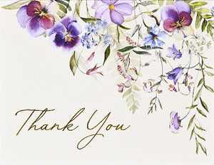 Card with floral design with 'Thank You' text on a light background