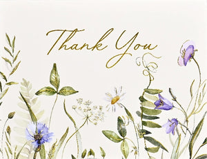 Card with floral design with 'Thank You' text on a light background