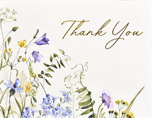 Card with floral design with 'Thank You' text on a light background