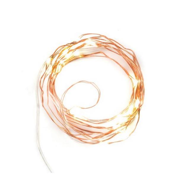 round bundle of copper string with yellow lights on a white background. kikkerland product.