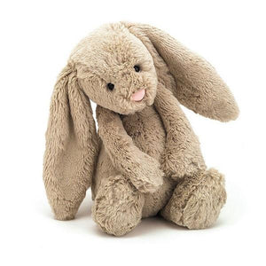 adorably soft plushie of a bashful beige bunny by popular brand Jellycat.