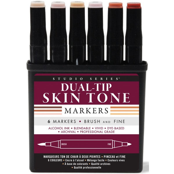 opened dark magenta and black box with various text. in bold, text reads "dual-tip skin tone markers". opened section of the container reveals six black markers with colour swatches at the top. colours are light beige, pink beige, yellow beige, off-white, light red brown, and medium red brown
